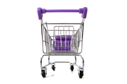 Miniature shopping cart isolated on white background.