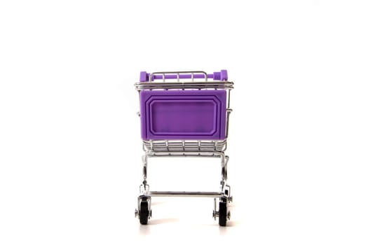 Miniature shopping cart isolated on white background.