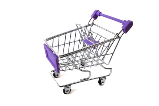 Miniature shopping cart isolated on white background.
