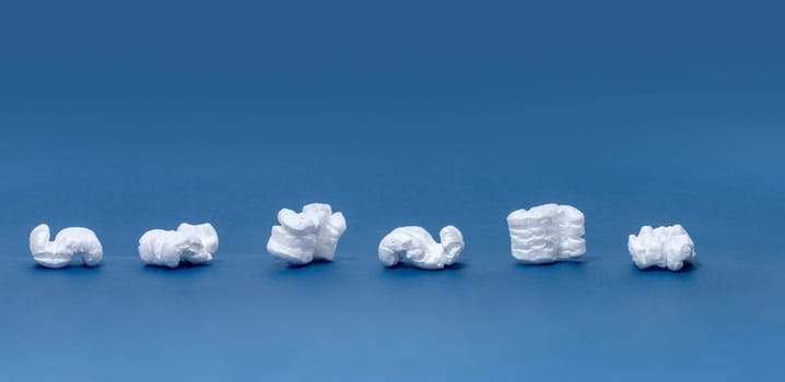 Polystyrene or white styrofoam packing pieces used for minimize bumps in transportation of goods.