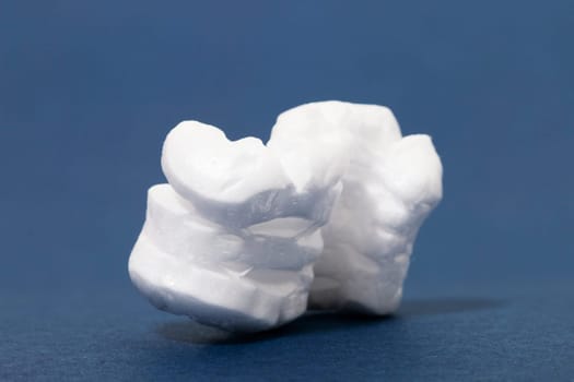 Polystyrene or white styrofoam packing pieces used for minimize bumps in transportation of goods.