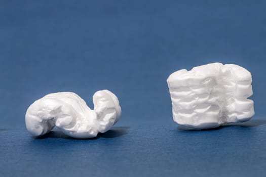 Polystyrene or white styrofoam packing pieces used for minimize bumps in transportation of goods.