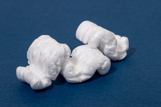 Polystyrene or white styrofoam packing pieces used for minimize bumps in transportation of goods.