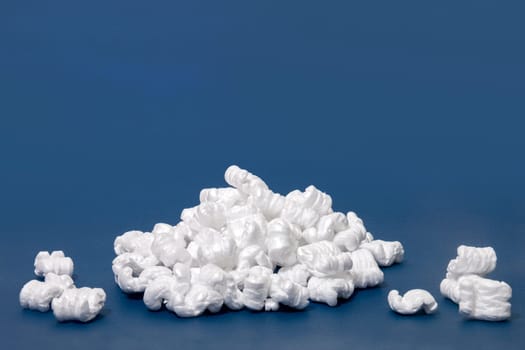 Polystyrene or white styrofoam packing pieces used for minimize bumps in transportation of goods.