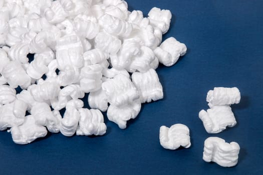 Polystyrene or white styrofoam packing pieces used for minimize bumps in transportation of goods.