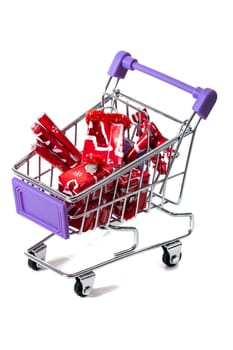 Miniature shopping cart isolated on white background.