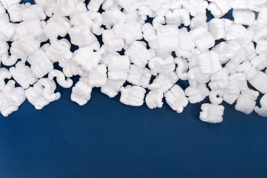 Polystyrene or white styrofoam packing pieces used for minimize bumps in transportation of goods.