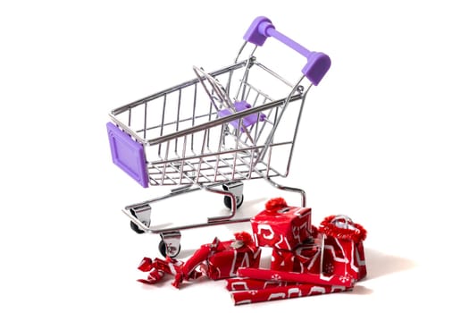 Miniature shopping cart isolated on white background.