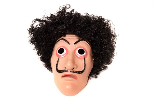 plastic costume face  mask with wig isolated on a white background.