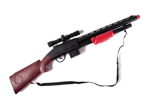 plastic shotgun toy isolated on a white background.