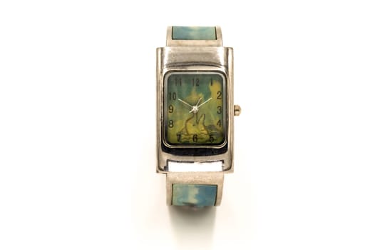 Lady's watch with a dolphin in the background on a white background