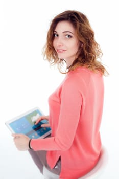 Portrait of cute joyful woman with trendy hairstyle wearing basic t-shirt talking on mobile phone isolated over white background.