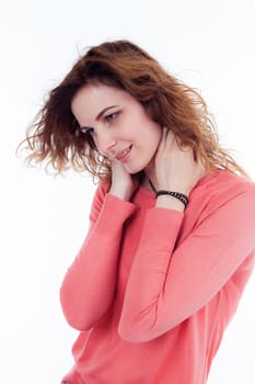 Portrait of cute joyful woman with trendy hairstyle wearing basic t-shirt talking on mobile phone isolated over white background.