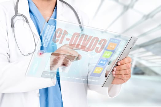 doctor in uniform with tablet, working in corona virus