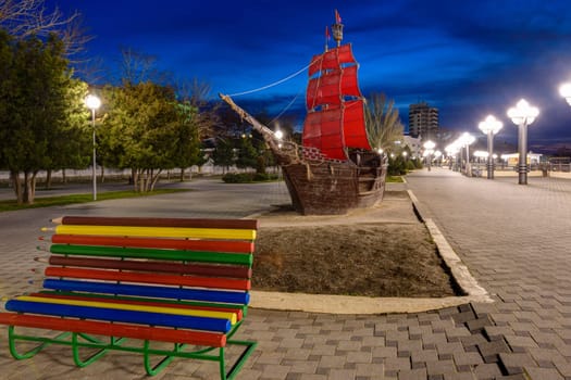 Anapa, Russia - March 3, 2020: The embankment of the resort city of Anapa and the landmark ship "Scarlet Sails"" after sunset"