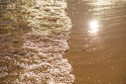 surf of the Baltic sea with evening sun