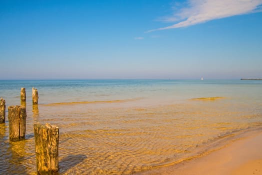 old groins in the Baltic Sea with blue sky