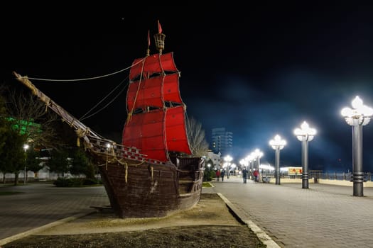 Anapa, Russia - March 3, 2020: The embankment of the resort city of Anapa and the landmark ship "Scarlet Sails"" after sunset"