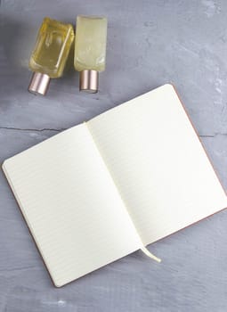 Spa with natural olive soap and sea salt and an open notebook for writing.