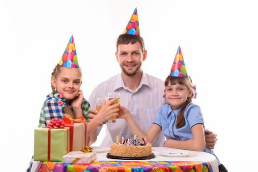 Kids and dad drink juice at a birthday party
