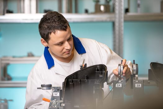 Scientists checking apparatus for accurate 3D measurements in a research laboratory.