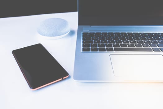 Home Office - PC, blouse, mobile phone and voice assistant, work at home.
