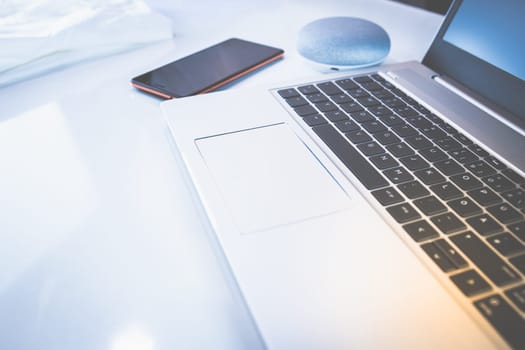 Home Office - PC, blouse, mobile phone and voice assistant, work at home.
