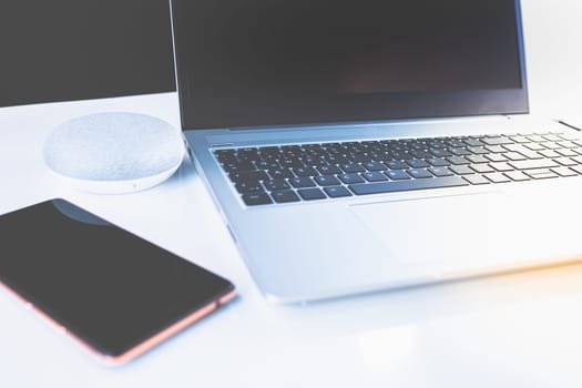 Home Office - PC, blouse, mobile phone and voice assistant, work at home.