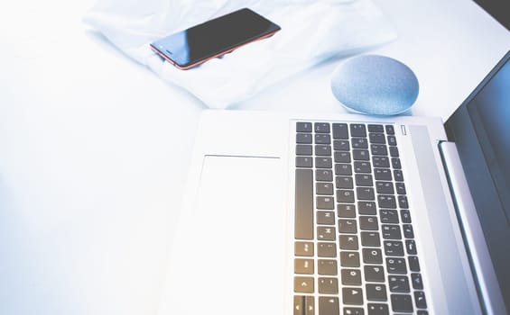 Home Office - PC, blouse, mobile phone and voice assistant, work at home.