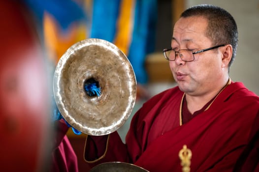 Naryn-Acagat temple, Ulan Ude, Siberia, Russia - March 09, 2020 : Buddhist monks are reading mantras in Dzogchen Duga. Buddhist monks are praying in an ancient Buddhist temple in Siberia near the Baikal lake.