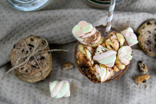 Cocoa with marshmallows and chocolate biscuits. Top views