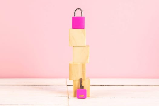 The wooden cubes are lined in the form of houses, next pads and keys. The concept of orend housing.