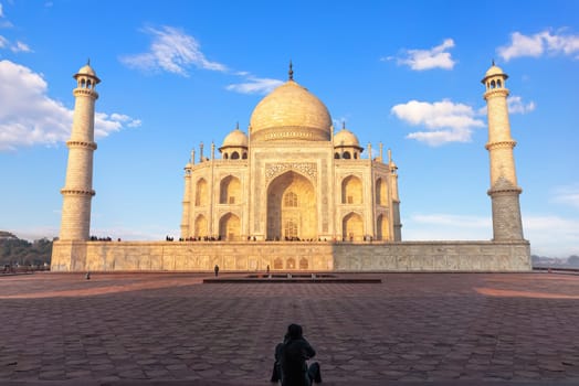 Famous Taj Mahal and a tourist, Agra, Uttar Pradesh, India.