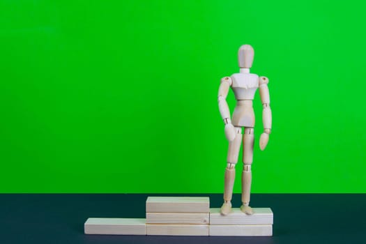 Full length portrait of male winner on winner's pedestal, on green background. The composition of 3 components: 2 place.