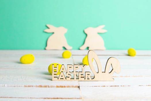 Easter holiday background. Easter bunny, eggs and text Happy Easter. Minimal modern concept.