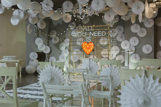 wooden arch and chairs at wedding ceremony