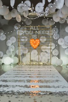 wooden arch and chairs at wedding ceremony