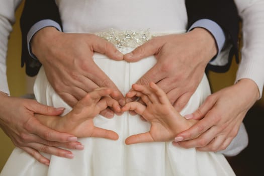 Family holding hands together closeup. conceptual idea
