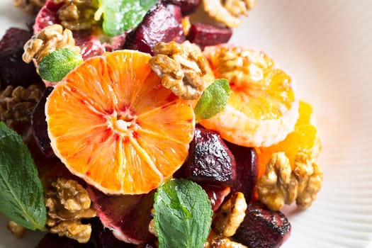 Beetroot and Orange salad with walnuts and mint leaves.