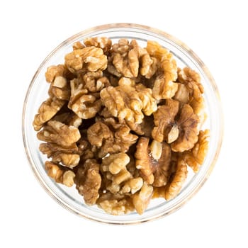 Walnuts in bowl isolated on white.
