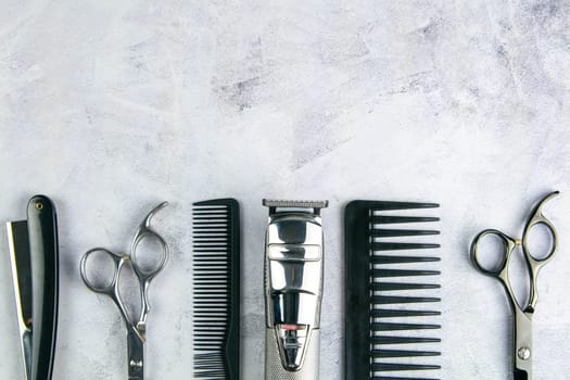 Scissors, hair clipper, combs, dangerous razor on a specific background. Hairdressing concept.