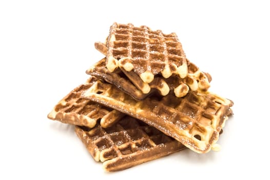 Mound of Belgian waffles on a white background