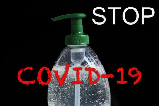 STOP COVID-19 Text, Clean Your Hands Often, Infection Prevention Coronavirus Concept, Rising Soap Bubbles In Pump Bottle On The Black Background. Close Up / Macro Shot