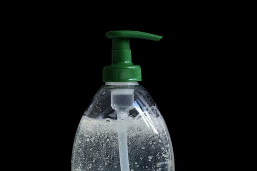 Hand-Washing To Prevent Coronavirus (COVID-19) Concept, Rising Soap Bubbles In Pump Plastic Bottle On The Black Background. Close Up View / Macro Shot