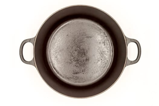Cast iron pan with two handles top view on a white background