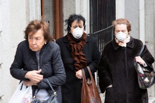 TOLEDO, SPAIN  - March 5: Unidentified women wearing masks to protect themselves and others from coronavirus. March 5, 2020 in Toledo, Spain.
