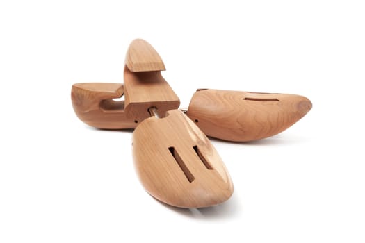 A Shoe tree made from cedar from the Woodlore company isolated on a white background.