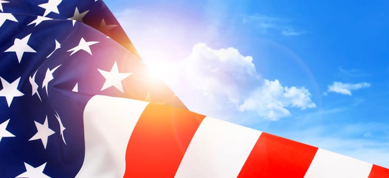 American flag on the background of the dawn sky. Top view, copy space for text.
