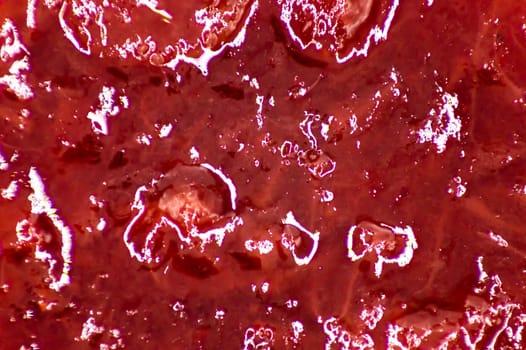 Strawberry jam background. macro strawberry jam background