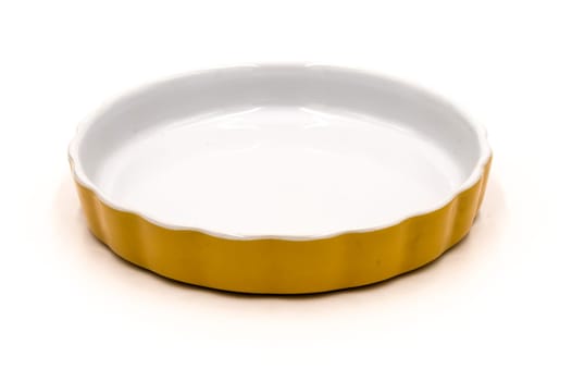 Orange flat porcelain ramekin on a white background